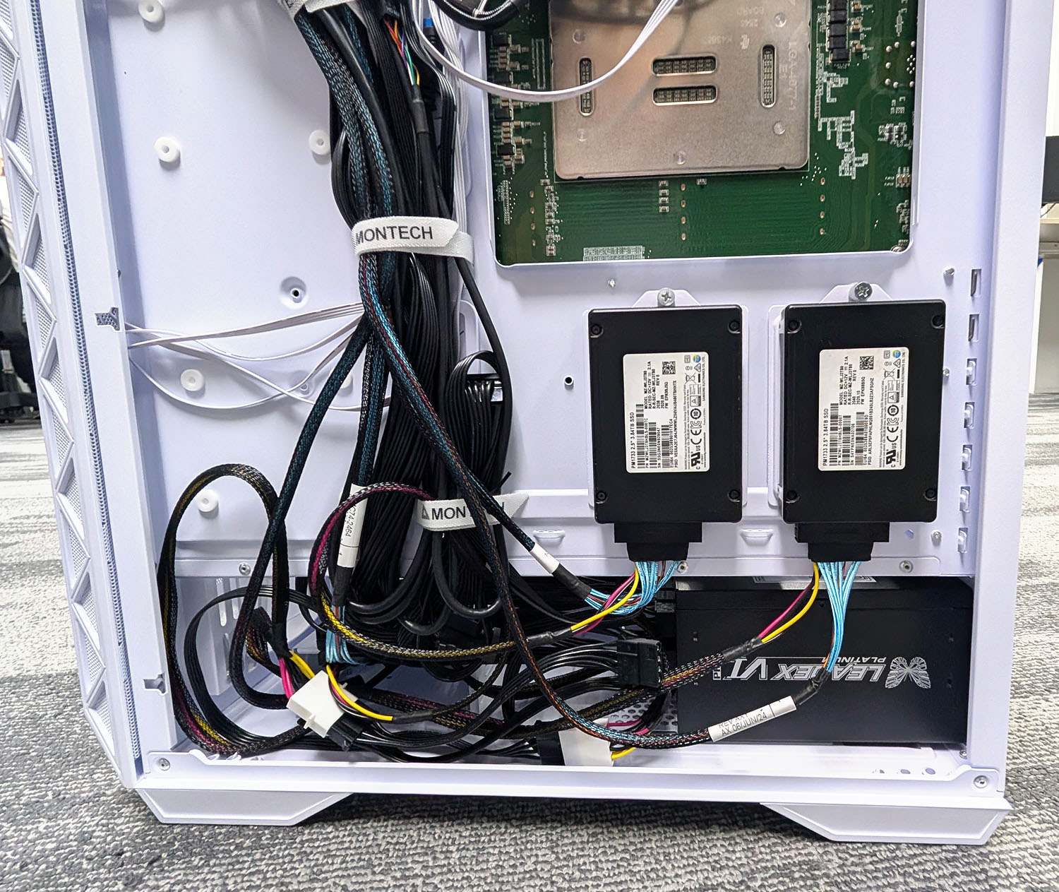 The back of the PC. The Micron SSD is hidden behind the cables because there's just so many wires all over.